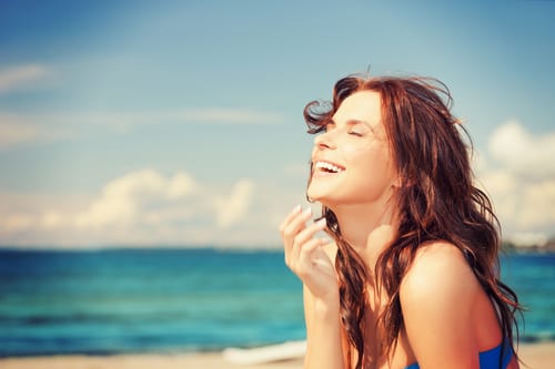 bright picture of laughing woman on the beach-img-blog