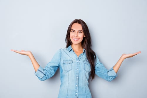 Happy smiling woman gesturing with hands and shown balance-img-blog