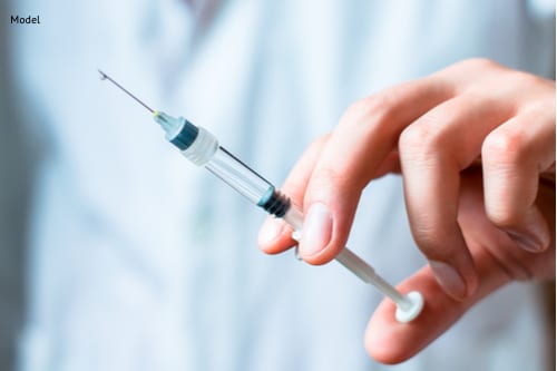Syringe, medical injection in hand, palm or fingers-img-blog
