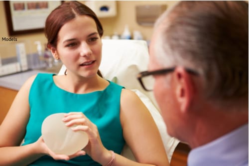 woman and surgeon discussing breast implants-img-blog