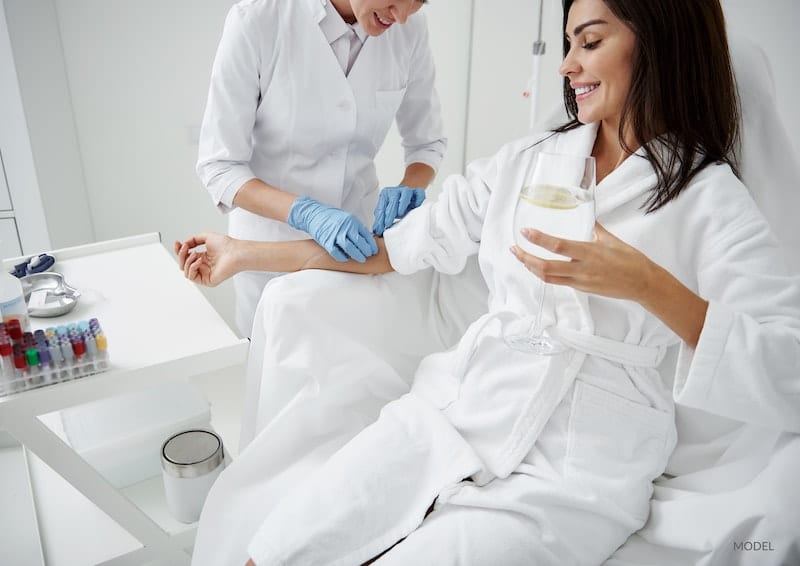 Young woman undergoing an IV therapy treatment for wellness at her MedSpa.