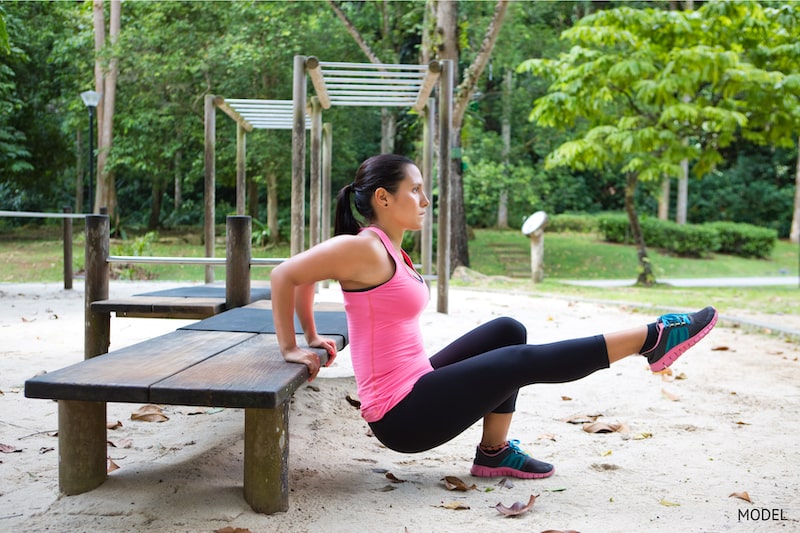 A woman exercising with confidence in the appearance of her arms and thighs.