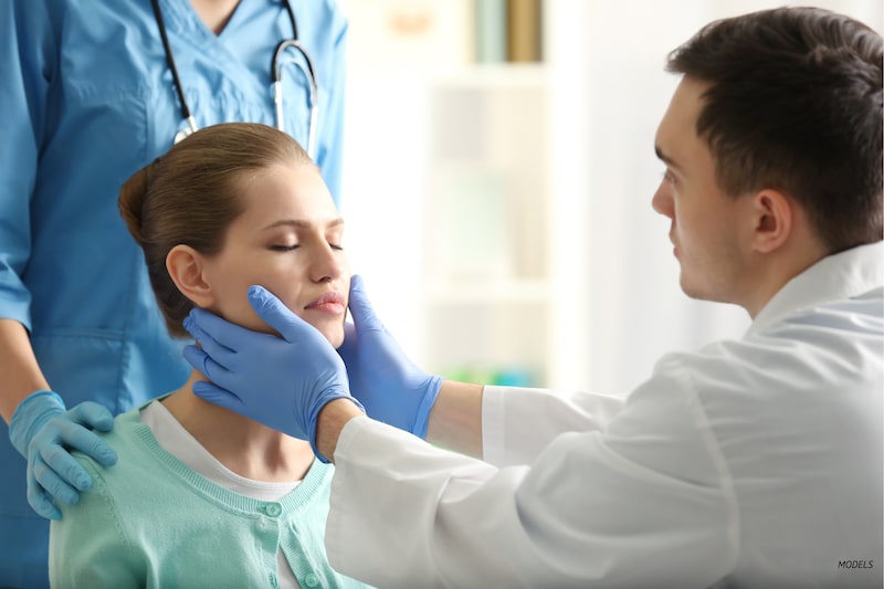 Woman undergoing a consultation with her doctor.