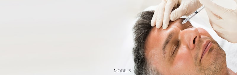 Man having BOTOX® Cosmetic injected between his eyebrows.