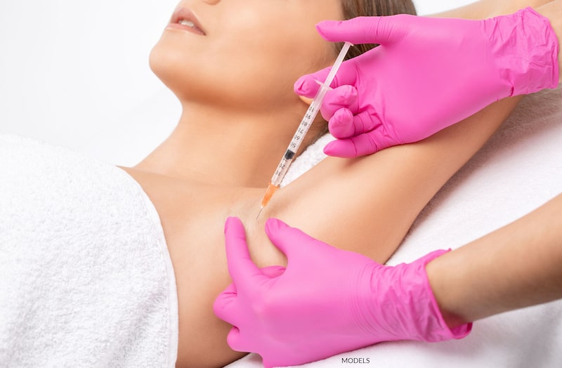 A woman receives injectable treatment for hyperhidrosis.