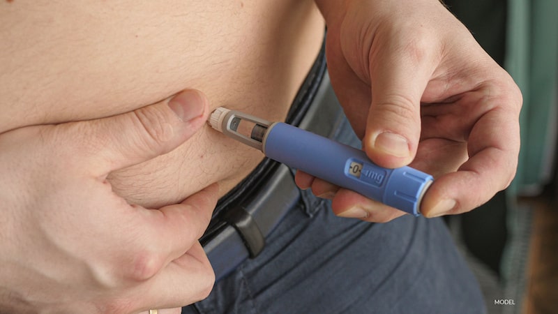 A weight loss patient injecting Ozempic® into his abdomen.