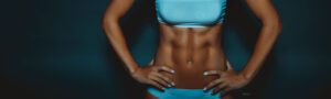 Cropped image of woman's sculpted abdominal muscles