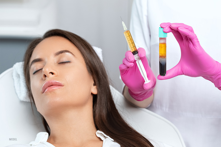 A woman relaxes as she prepares to receive a PRP skin treatment.